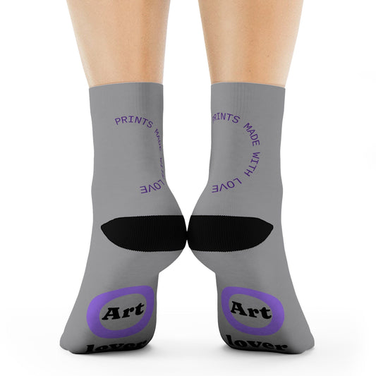Gray socks with black and purple text and design on a white background