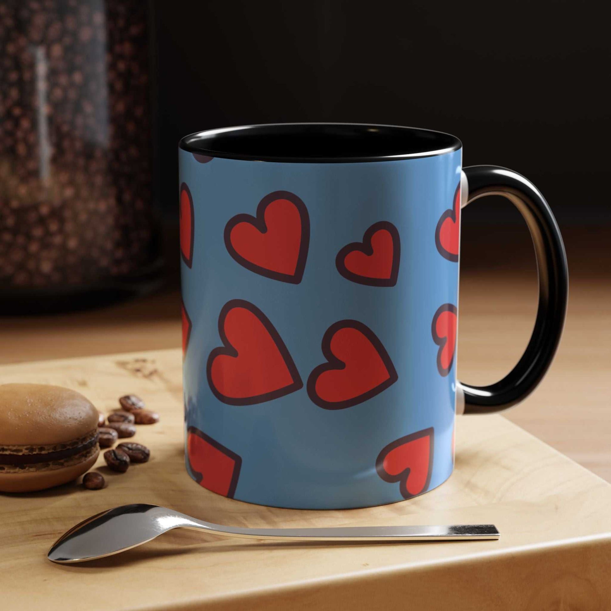 Vibrant Love Accent Coffee Mug with red hearts on blue background and black handle, microwave and dishwasher safe ceramic mug