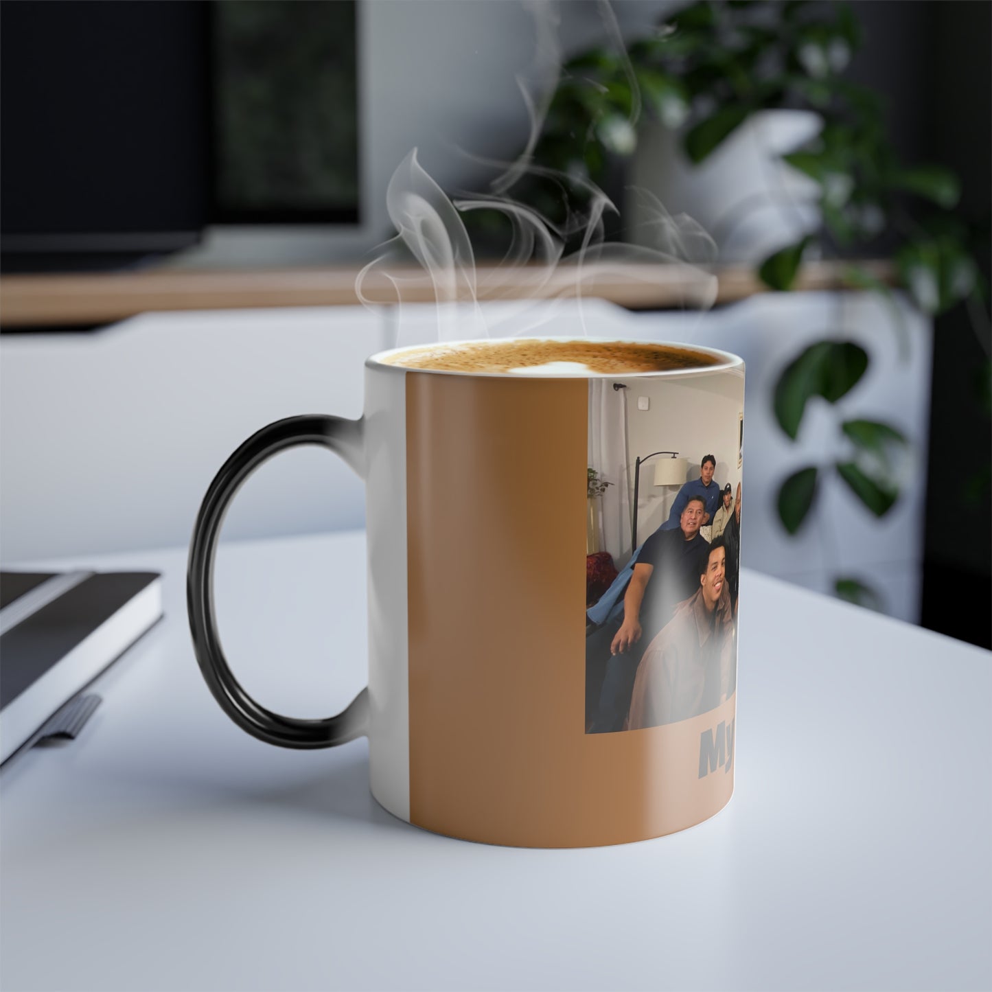 Steaming mug with a printed design on a desk