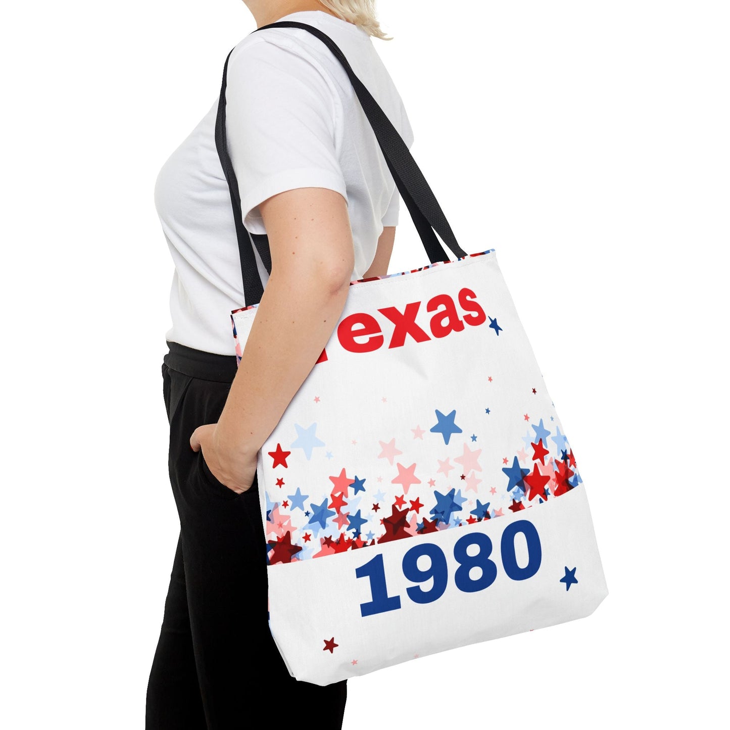 Person carrying chic tote bag with Texas 1980 star pattern and black handles