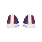 Women's colorful leopard print low top sneakers with vibrant multicolor design and white soles