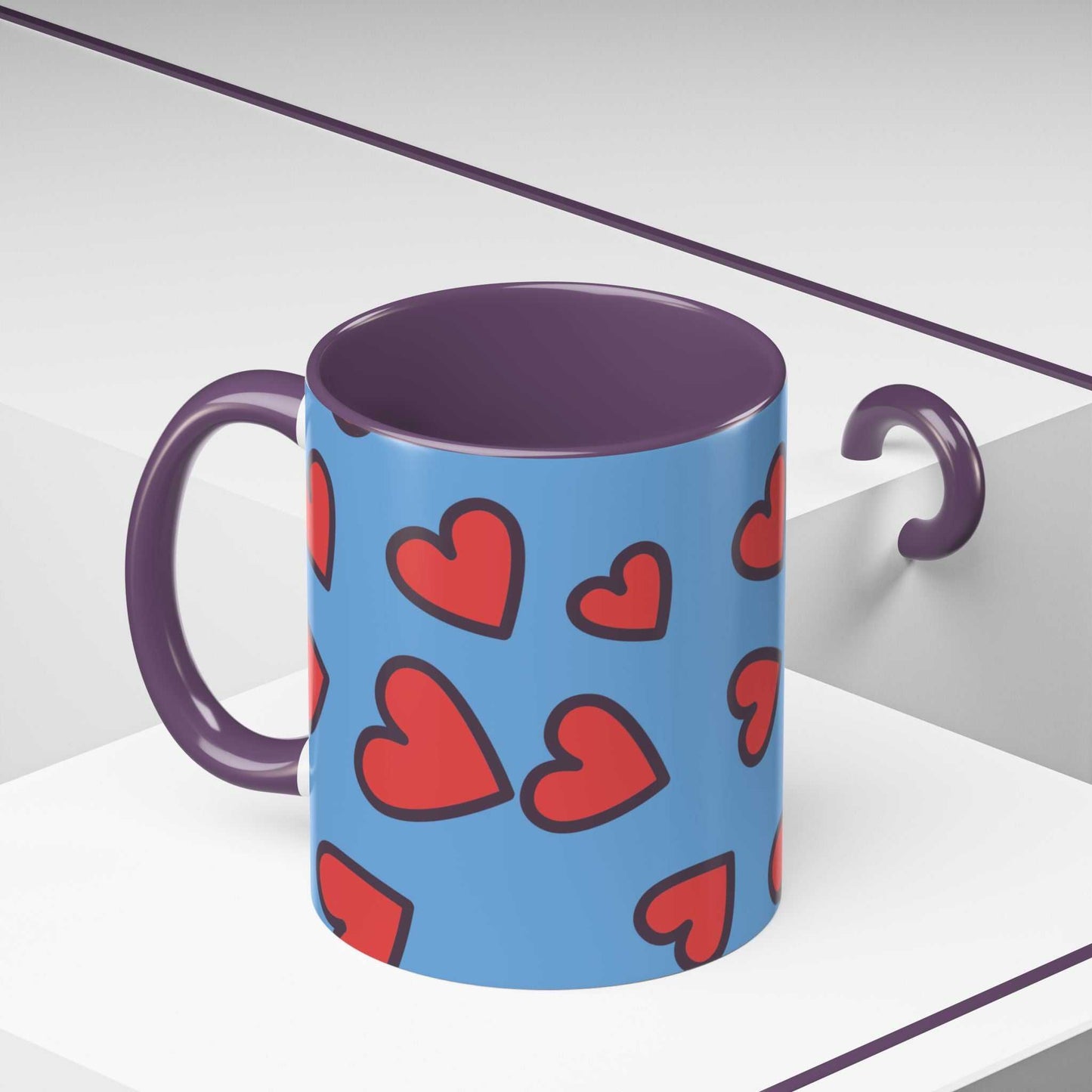 Vibrant Love Accent Coffee Mug with purple handle and red hearts on blue background, microwave and dishwasher safe ceramic cup