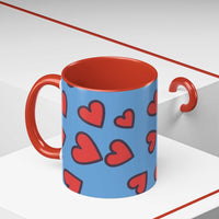 Vibrant Love Accent Coffee Mug with red hearts on blue background and red interior and handle
