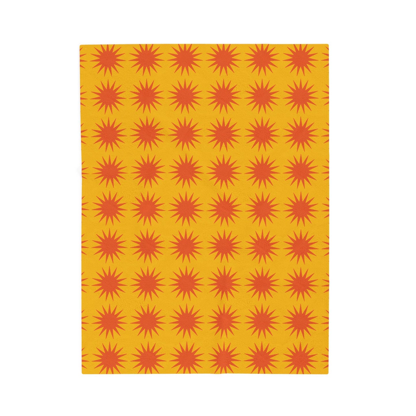 Cozy velveteen plush blanket with vibrant orange sunburst pattern on yellow background for home decor and comfort