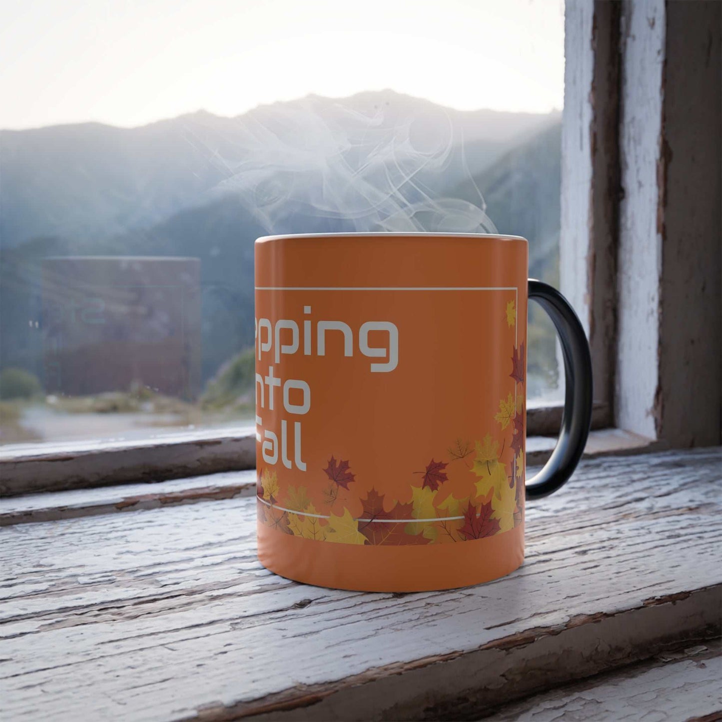 Color Morphing Mug with autumn leaves design steaming on rustic windowsill