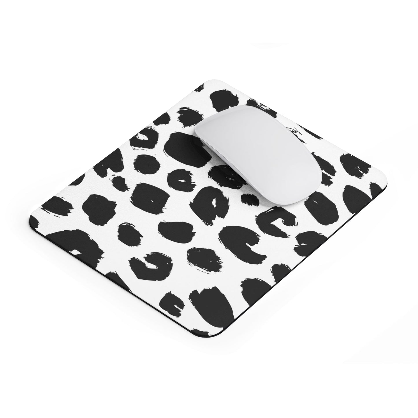 Chic leopard print mouse pad with black and white spots, soft spongey surface, non-slip base, stylish office desk accessory.