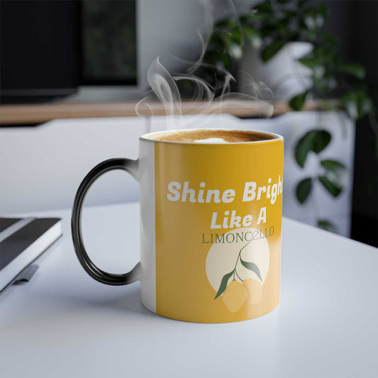 Yellow color changing mug with "Shine Bright Like A Limoncello" text and lemon graphic, steaming hot beverage inside