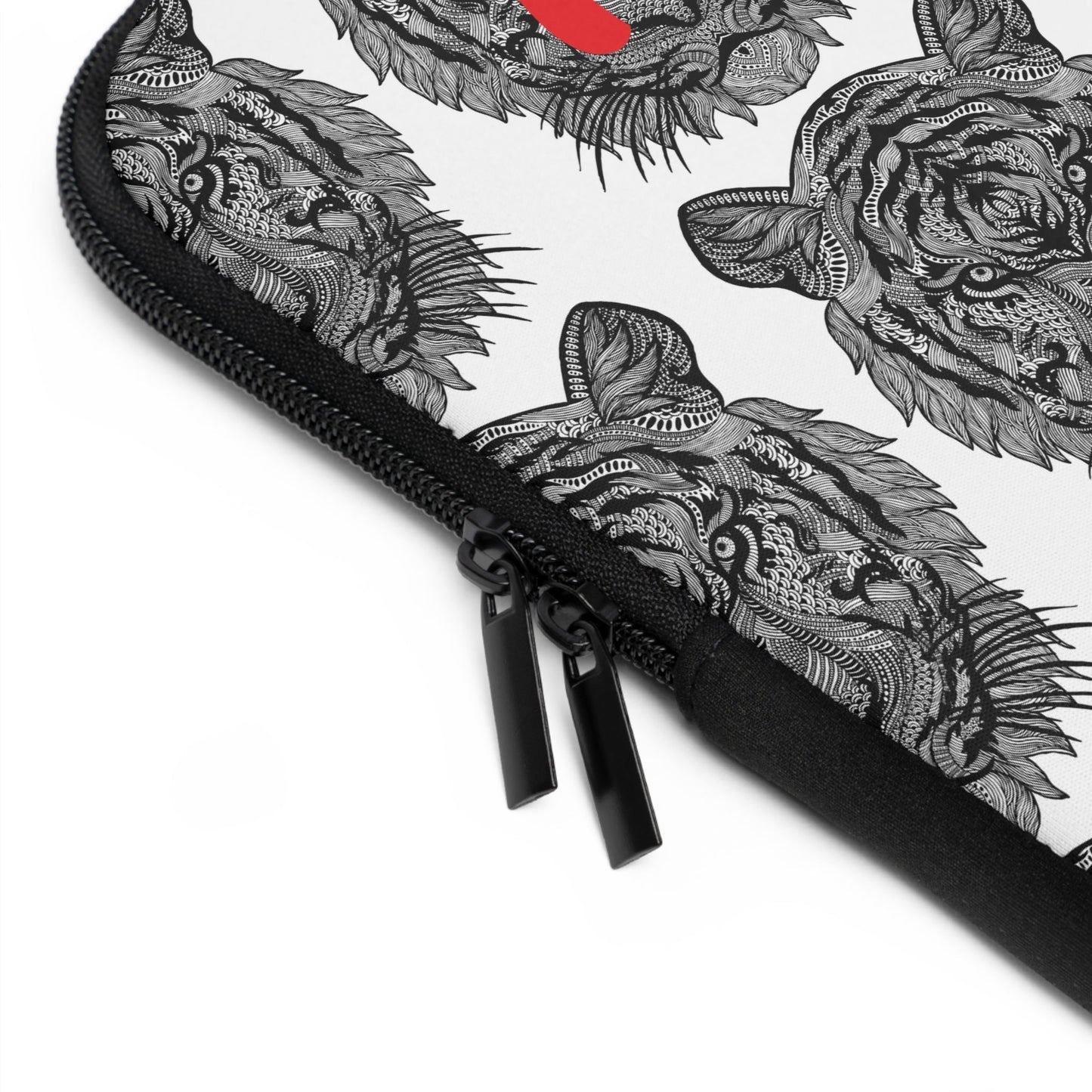 Close-up of laptop sleeve with black zipper and tiger design on white neoprene material