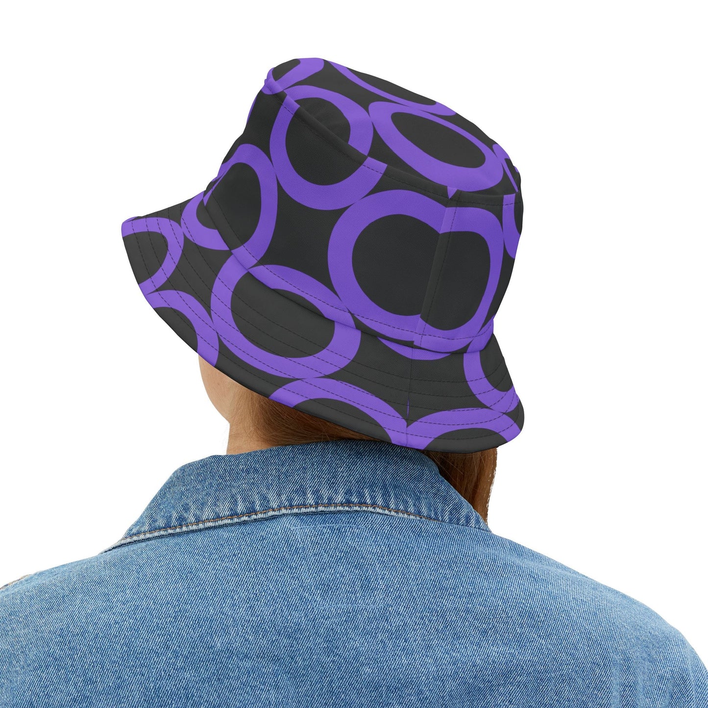Purple dot pattern bucket hat worn with denim jacket, stylish summer sun protection accessory