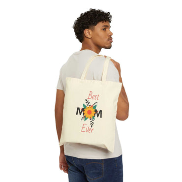 Man carrying Best Mom Ever cotton canvas tote bag with floral design