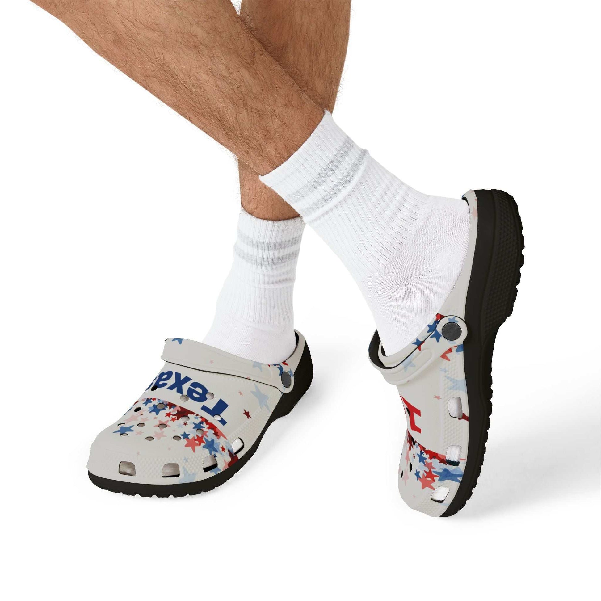 AOP EVA Texas Vibe foam clogs with colorful Texas-themed print and black sole worn with white socks