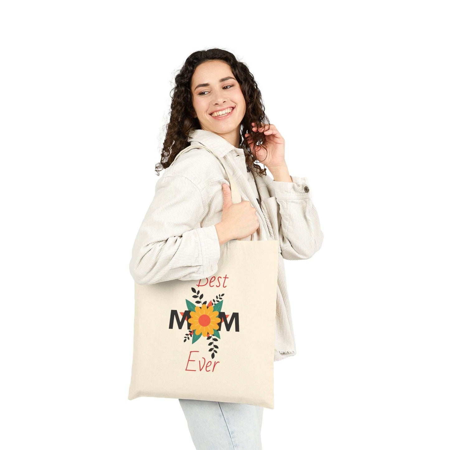 Woman carrying a Best Mom Ever cotton canvas tote bag with floral design