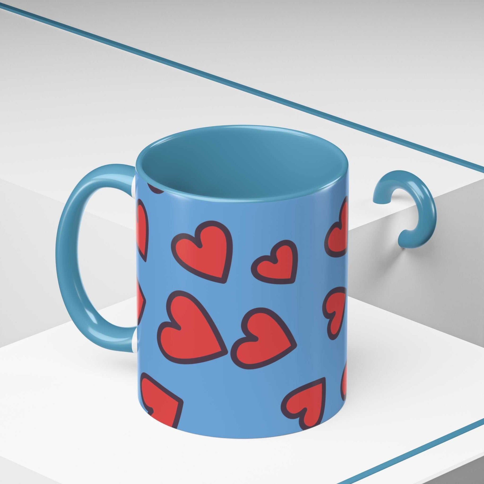 Blue ceramic coffee mug with red heart accents and handle, vibrant love accent coffee mug design