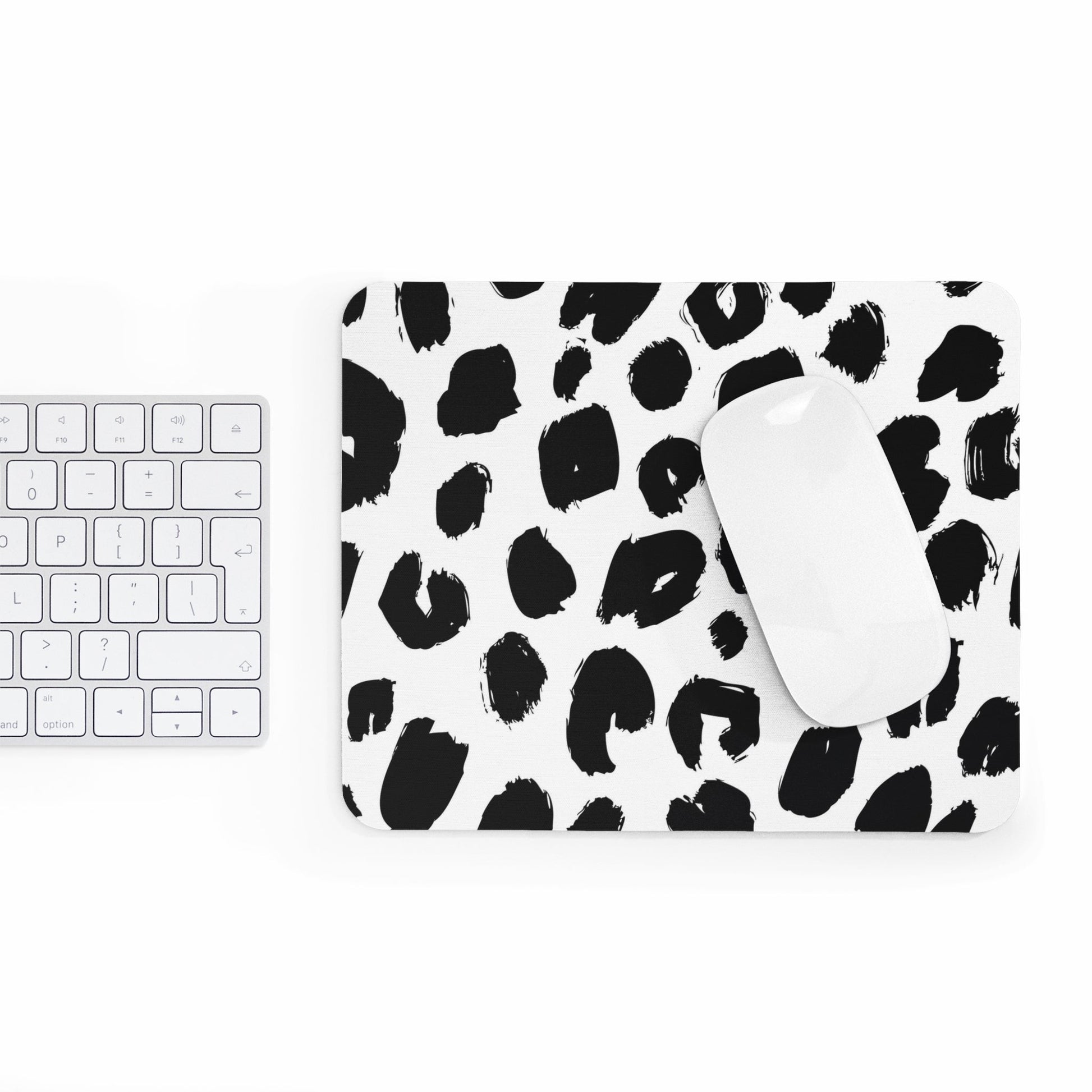 Chic leopard print mouse pad with black and white design beside white keyboard and mouse