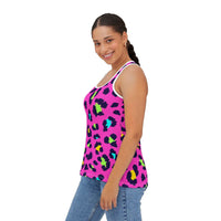 Woman wearing vibrant leopard print tank top with bright multicolor spots and high-cut neckline