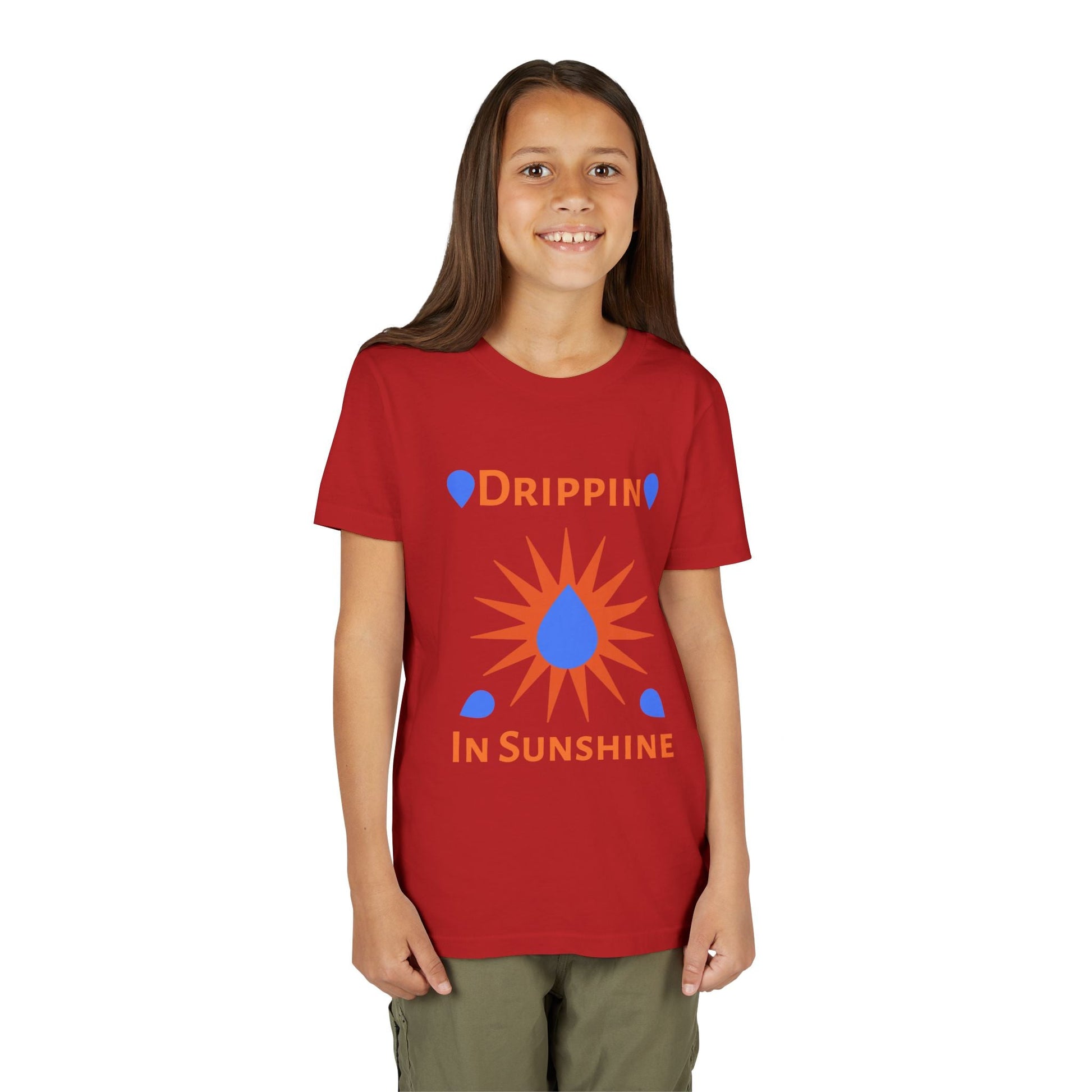 youth short sleeve tee red with sunshine design worn by smiling child