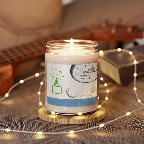 burning scented soy candle in glass jar with confidence aroma and fairy lights on wooden coaster