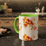 Fall cozy season mug with colorful autumn leaves design and green handle