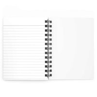 Open autumn-inspired spiral bound journal showing lined and blank pages for writing and sketching