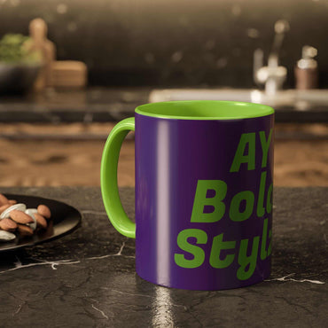Colorful custom mug with purple exterior and green interior, bold text design, glossy ceramic finish, kitchen countertop background