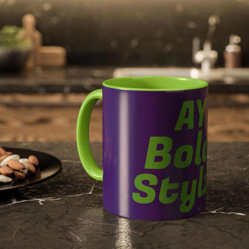 Colorful custom mug with purple exterior and green interior, bold text design, glossy ceramic finish, kitchen countertop background