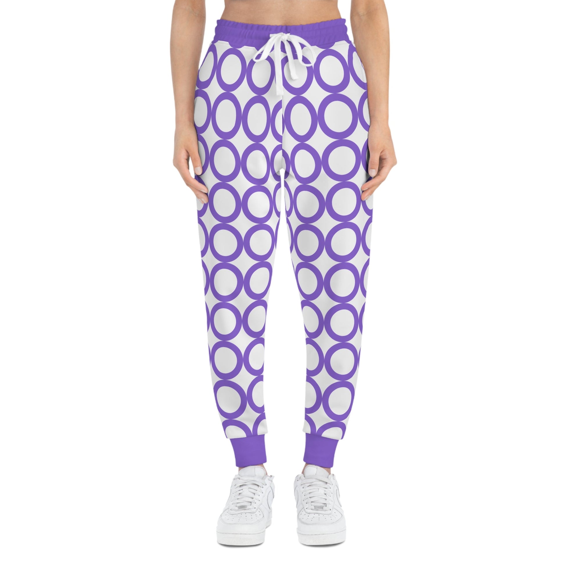 Stylish athletic joggers with purple circular pattern, drawstring waist, and side pockets