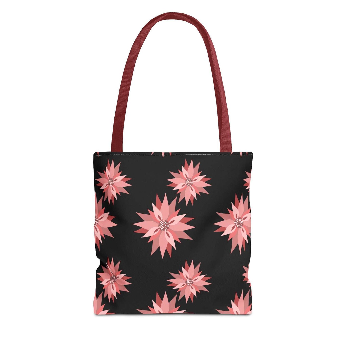 Colorful AOP Tote Bag with pink floral design on black background and maroon handles, reusable shopping bag