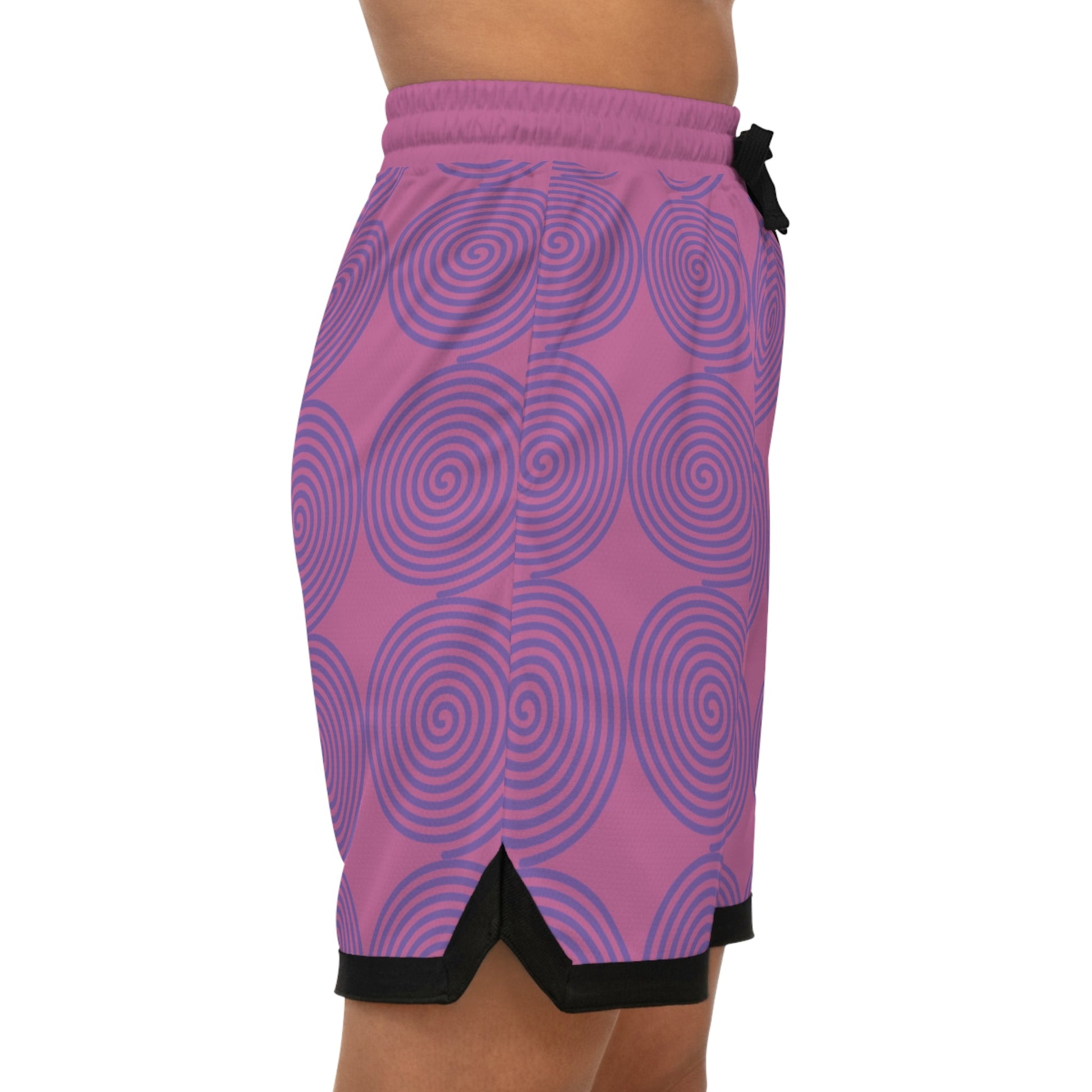 Women's basketball rib shorts with purple spiral design and black detailing, made of moisture-wicking polyester