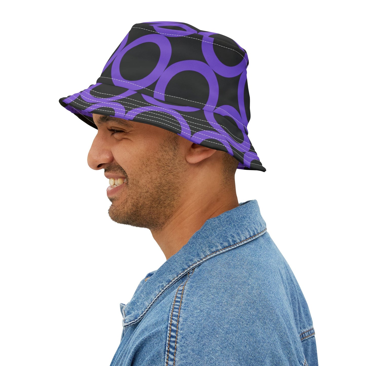 Man wearing purple dot pattern bucket hat with adjustable brim and denim jacket
